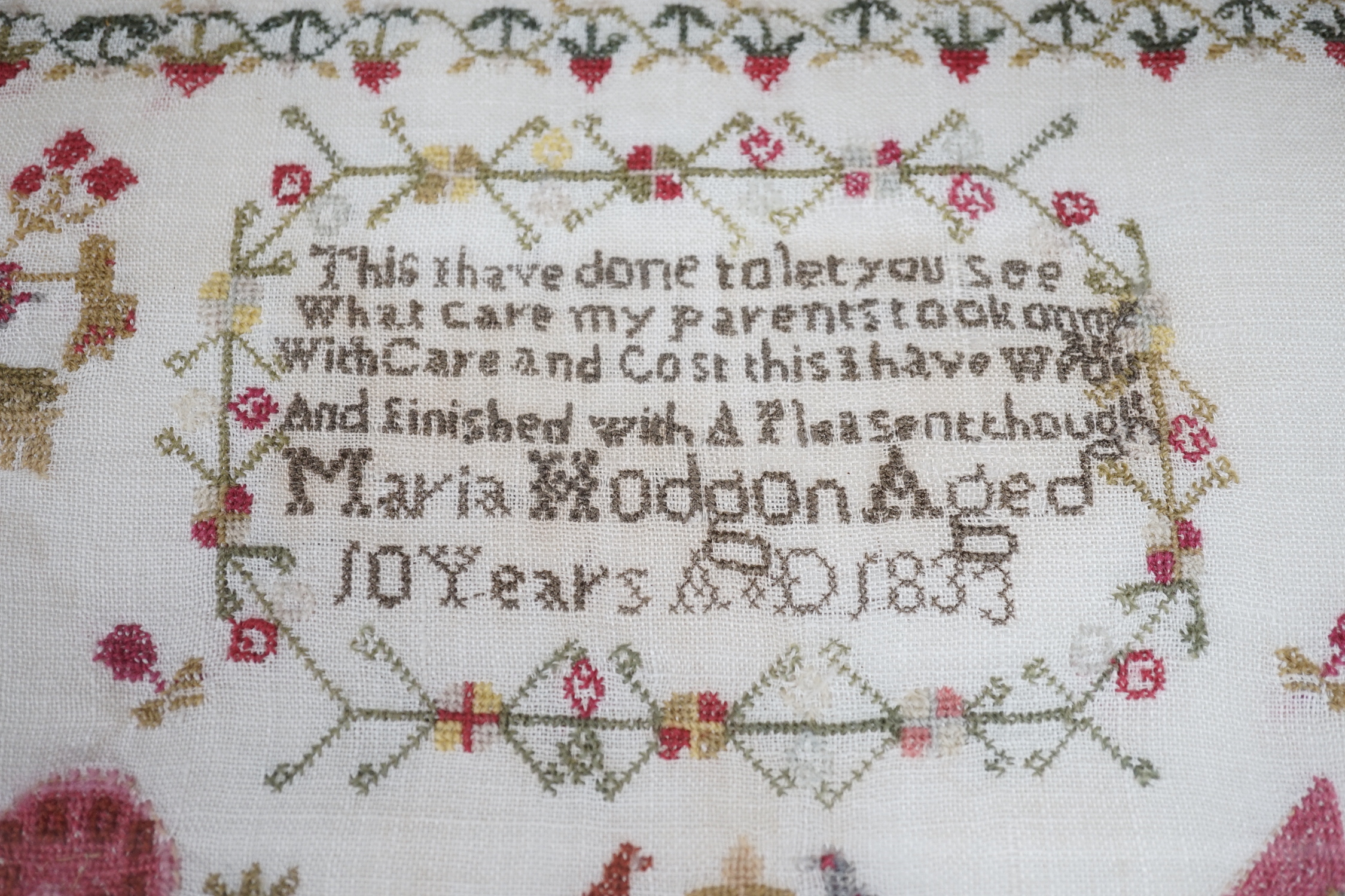 A framed 19th century sampler, 44cm sq excl frame